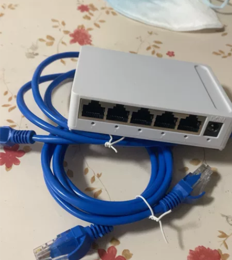 彩箭千兆交换机5口迷你家用百兆校园宿舍路由...