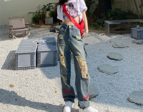 辣妹风高街乞丐个性破洞牛仔裤女2022年欧...